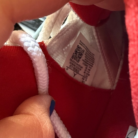 Air Jordan 11 Retro White and Red Sneakers - Picture 4 of 6